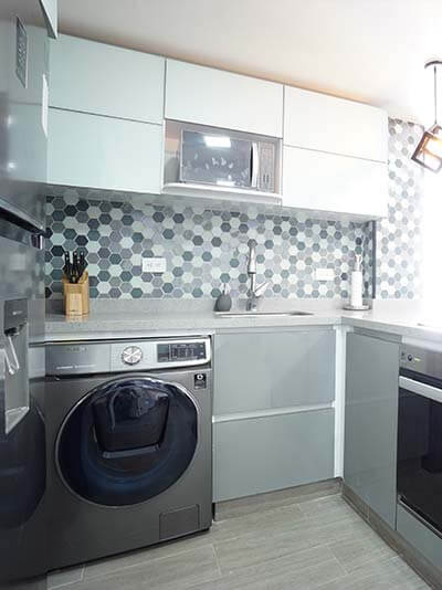 Kitchen with oven, fridge, and washer/dryer combo